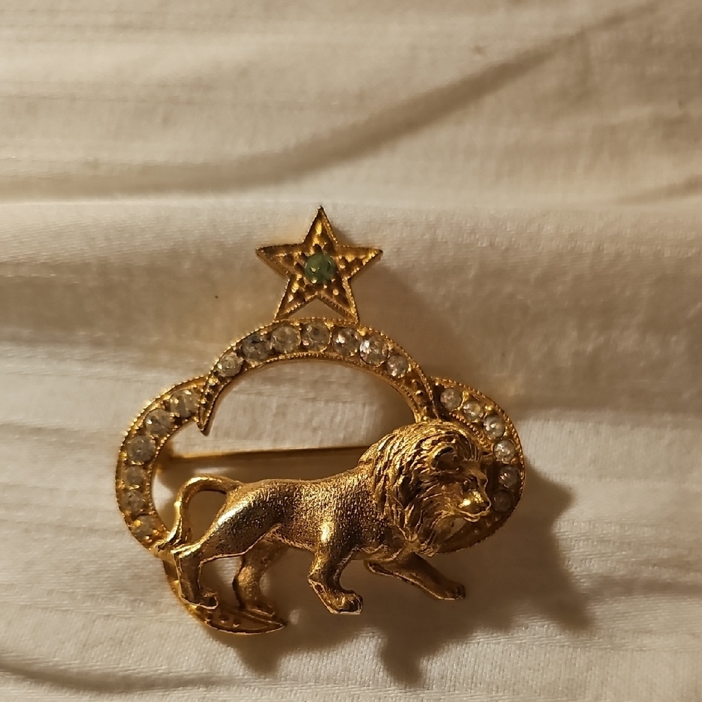 Gold Lion Brooch with Star Accent